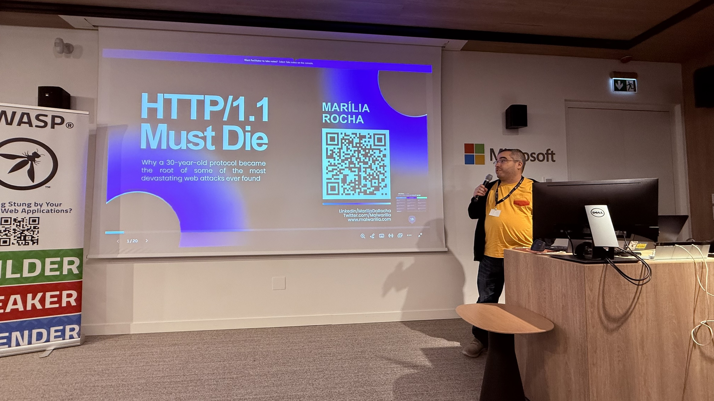 OWASP Lisboa #13 A speaker stands at the podium in the Microsoft office presenting Marília Rocha's session titled "HTTP/1.1 Must Die" during the OWASP Lisboa #13 meetup.