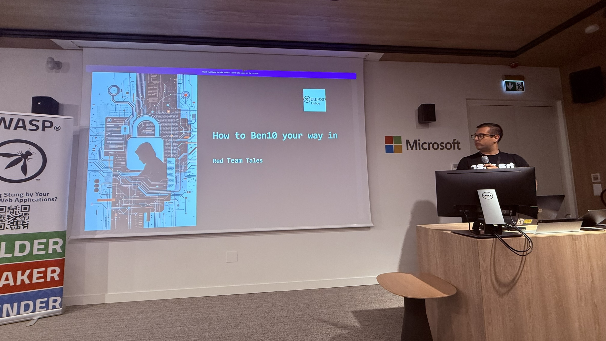 OWASP Lisboa #13 Speaker David Marques at a Microsoft podium presenting "How to Ben10 your way in - Red Team Tales" at the OWASP Lisboa #13 cybersecurity meetup.